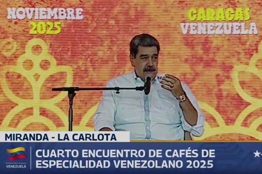 Venezuelan President Nicolás Maduro speaking into a microphone.