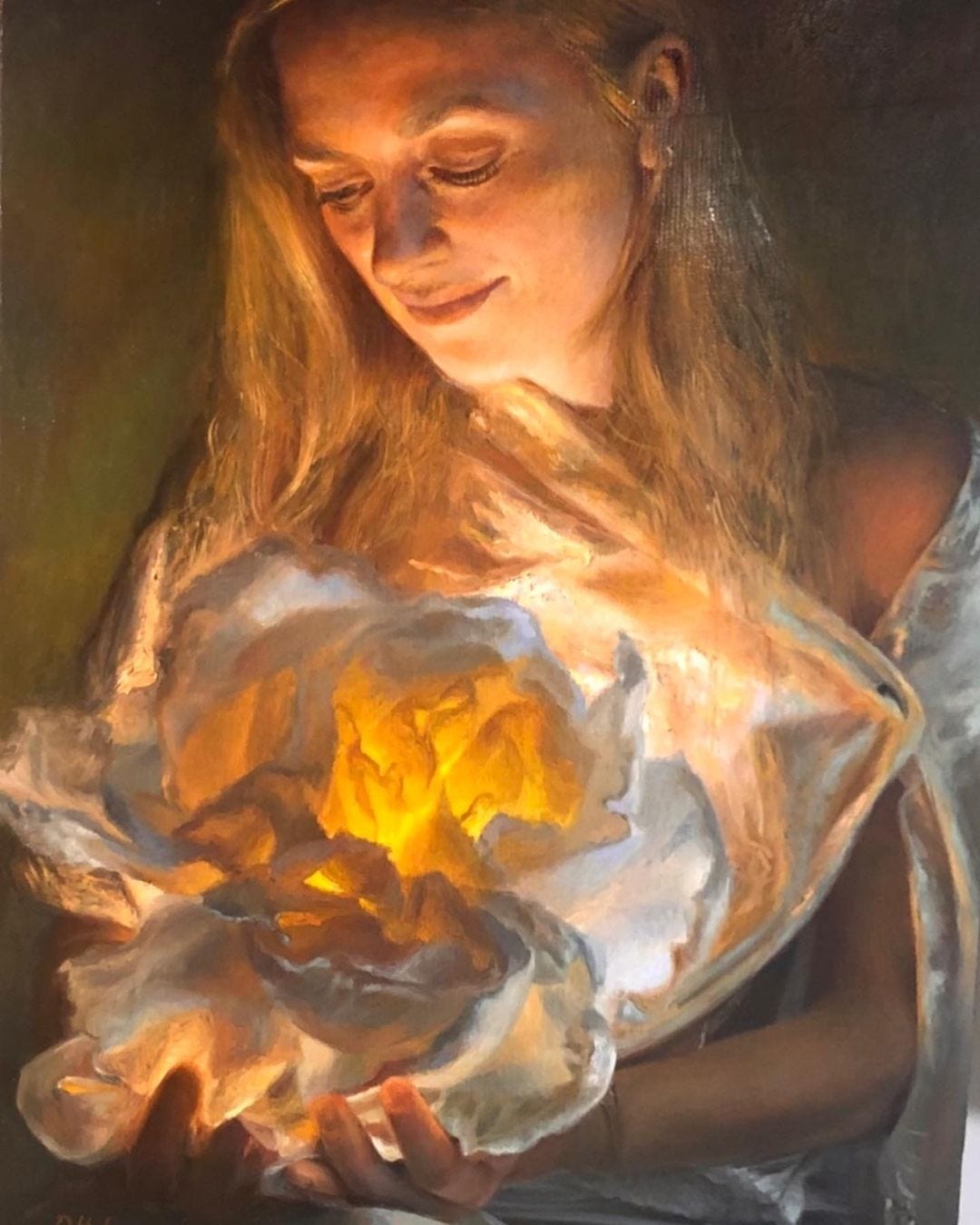 A woman cupping a luminous bloom against a shadowed background; desire turned into its own source of light.