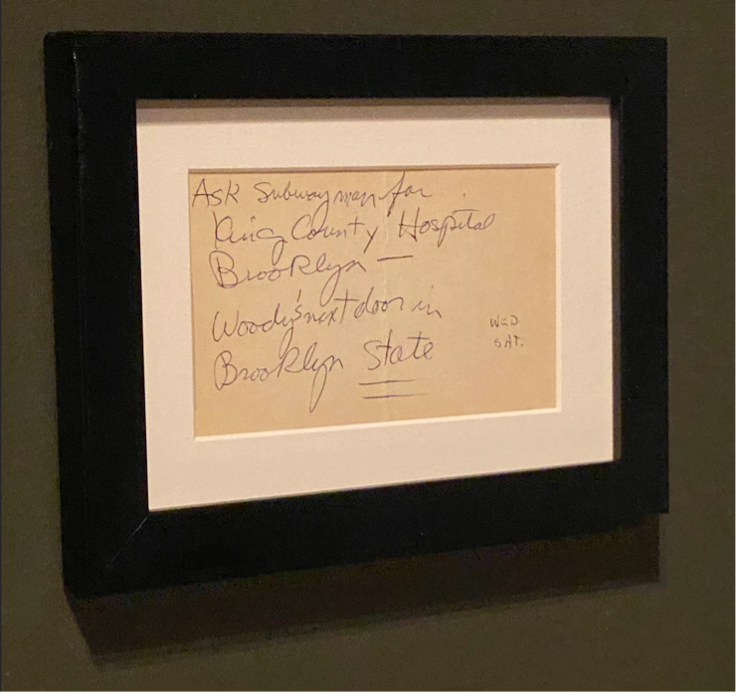 photograph of a card featuring Dylan's handwritten directions to visit Woody.