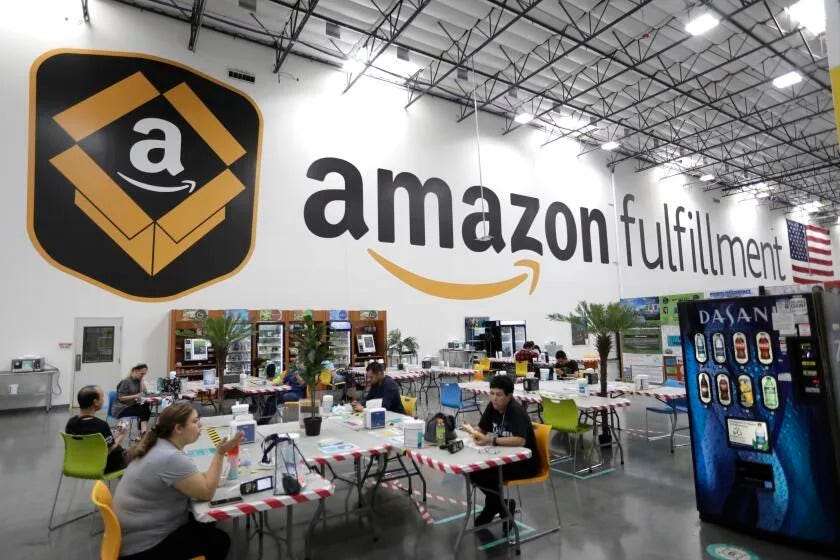 MORENO VALLEY, CA - SEPTEMBER 29, 2021 - - Workers enjoy a break at the Amazon Fulfillment Center in Moreno Valley, California, on September 29, 2021. (Genaro Molina / Los Angeles Times)