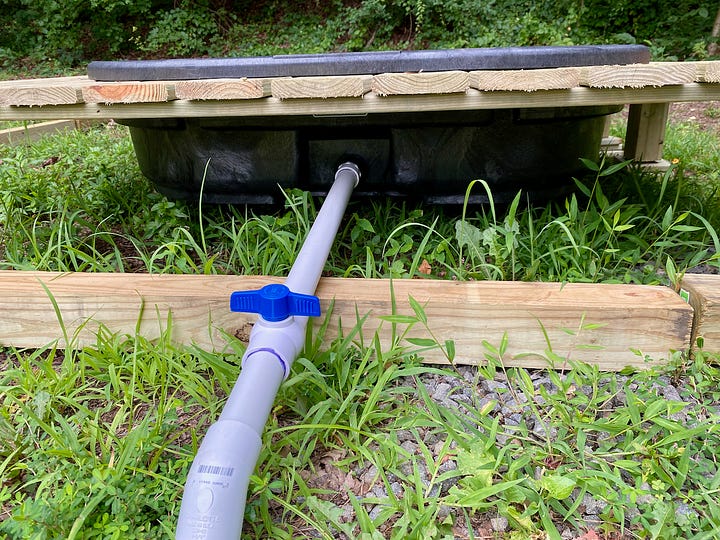 Duck pool on a raised deck and PVC plumbing to drain the pool.