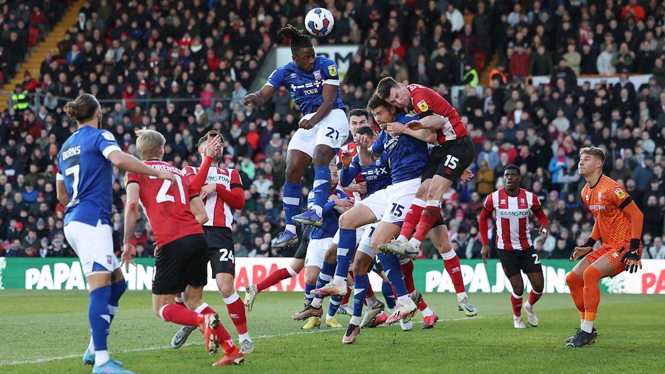 Ipswich v Lincoln, January 2023, Cameron Burgess is attacking a corner, but unable to jump because his marker is on top of him.