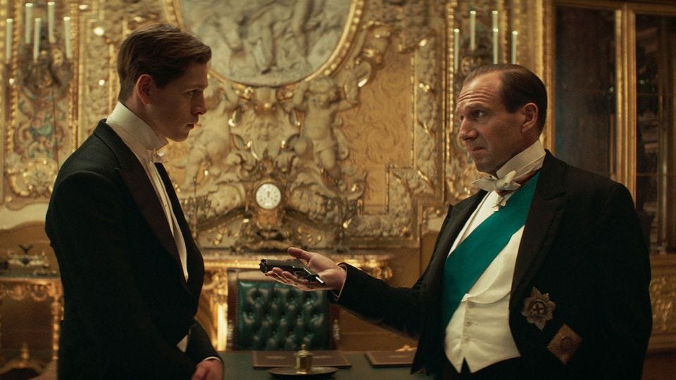 The Duke of Oxford hands Conrad a small gun. Both are in fancy dinner-attire at the Tsar's palace. The Duke of Oxford hands Conrad a small gun. Both are in fancy dinner-attire at the Tsar's palace.