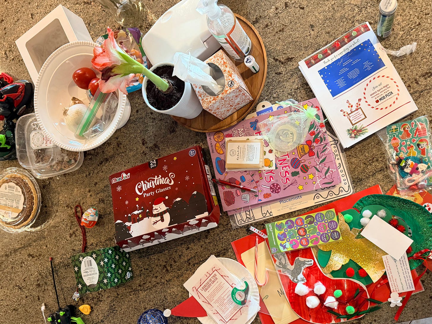 a kitchen island covered in an assortment of items, mostly holiday related.