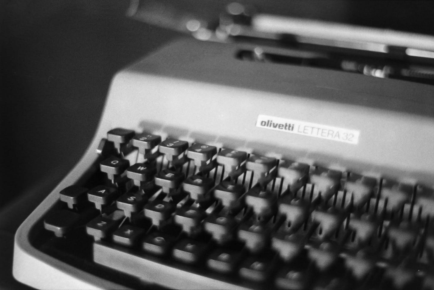 A black and white photograph of an Olivetti Lettera A black and white photograph of an Olivetti Lettera