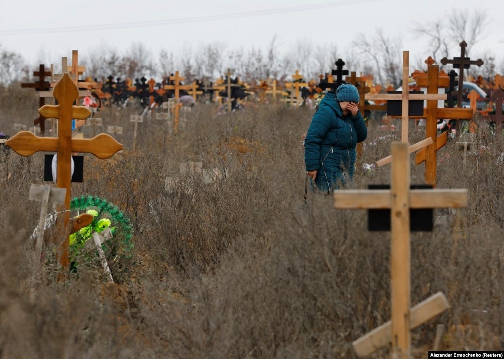 Iryna Orfinyak during the visit to her granddaughter Veronika&rsquo;s grave. &nbsp; According to Orfinyak, ten people were killed in the mortar explosion, including three children. Veronika, &ldquo;was thrown against the entrance door. She was wounded and died while we were taking her to hospital,&rdquo; the breaved grandmother told Reuters, adding, &ldquo;our son was killed immediately.&quot; &nbsp;
