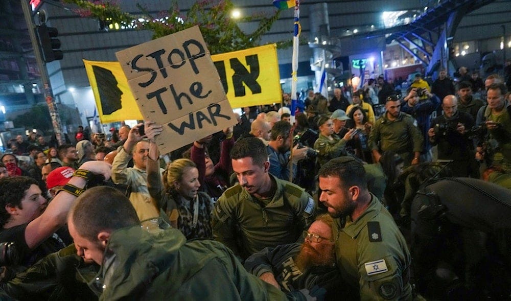 Police scuffle with demonstrators who block a road during a protest demanding a cease-fire deal and the immediate release of captives held in the Gaza Strips, in Tel Aviv, Police scuffle with demonstrators who block a road during a protest demanding a cease-fire deal and the immediate release of captives held in the Gaza Strips, in Tel Aviv,