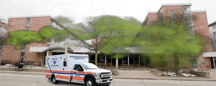 An ambulance in front of Burge Residence Hall