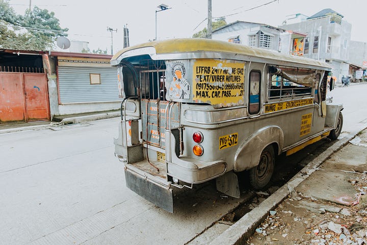 A bus on an urban street in the Philippines
