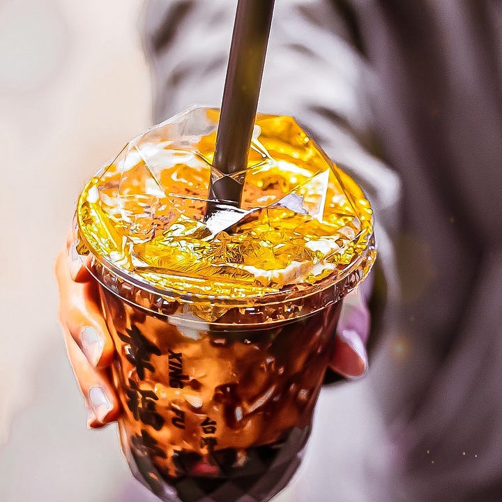 Bon Bonn Swedish Candy in a glass coupe; Gold Foil Boba Milk from Xing Fu Tang.