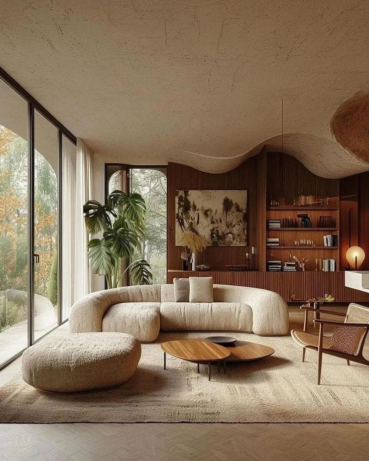 This may contain: a living room filled with furniture and large windows