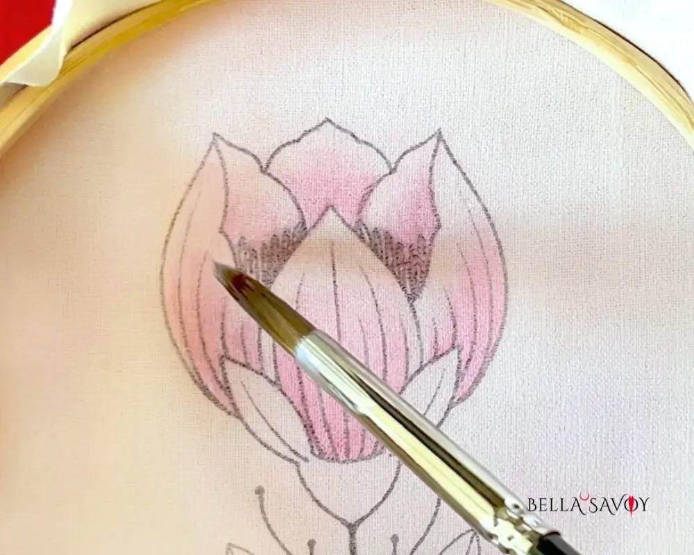 Learn How to Color Fabric with Crayons 126 paint brush adding Mod Podge to color on embroidery design