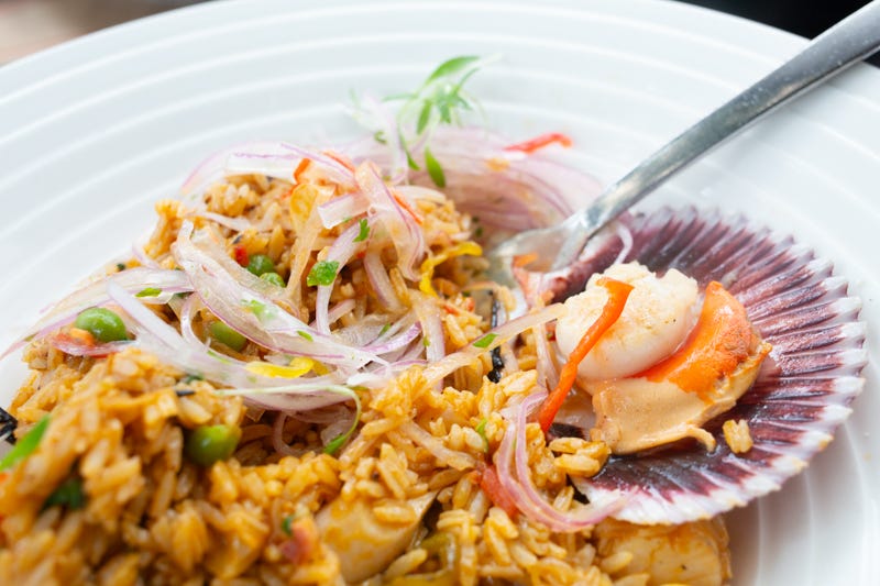 Savoring each bite of Arroz con Mariscos at El Mercado