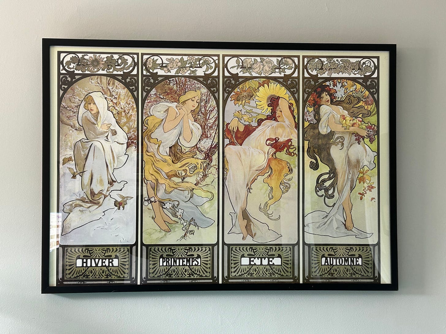 Framed print of The Four Seasons by Alphonse Mucha (1897). In order: Hiver, Printemps, Ete, Autumne.