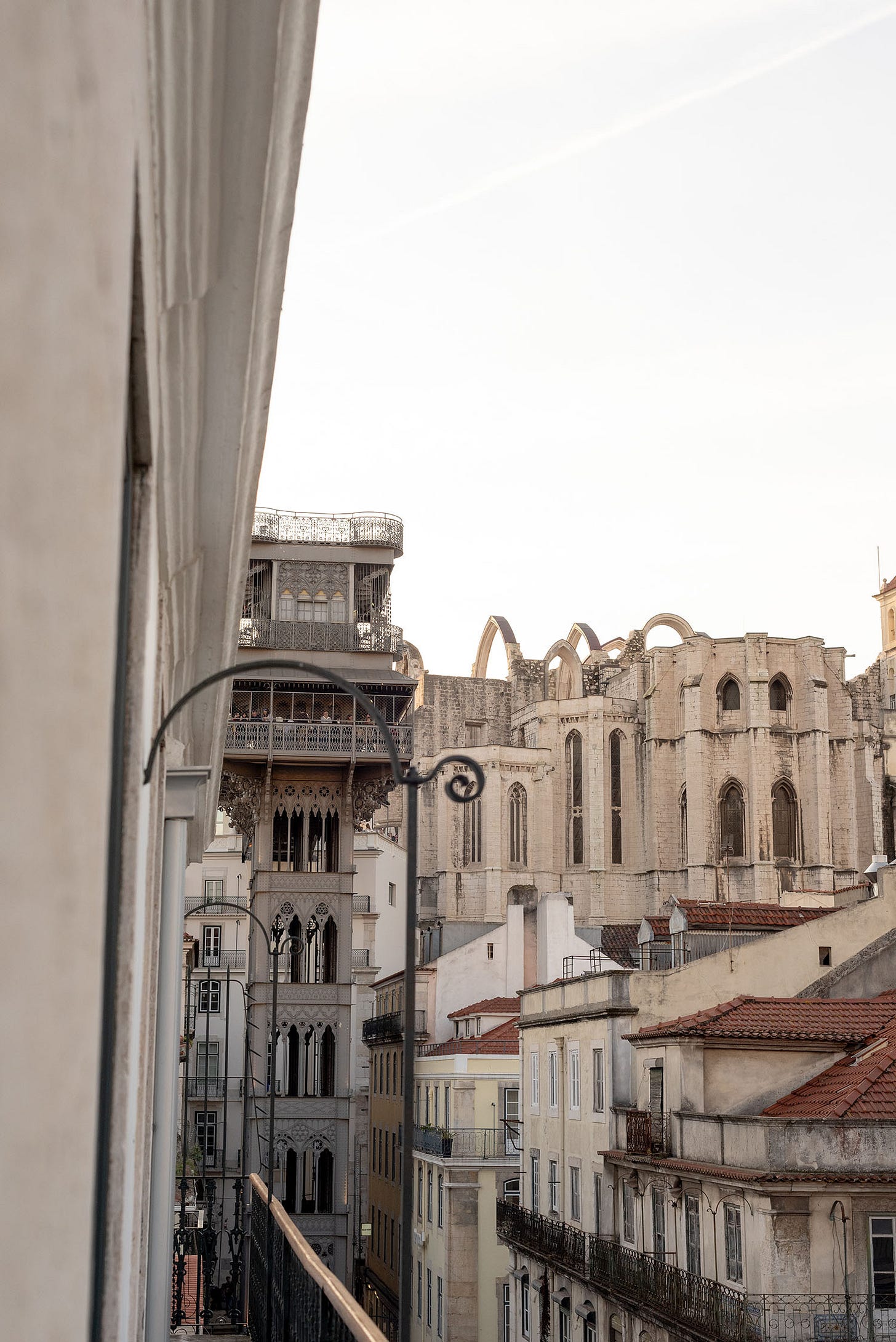 View of Carmo Convent and Santa Justa elevator from a balcony in Lisbon, Portugal