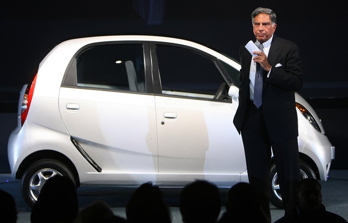 Indian business tycoon showered with praise for riding country's cheapest  car | The Independent