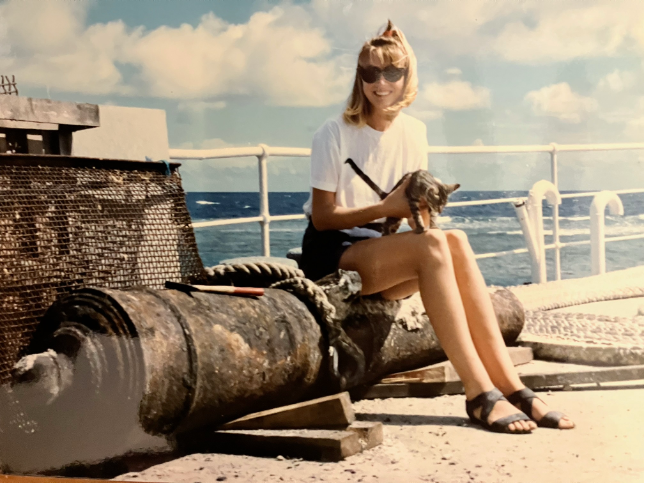 A person sitting on a pipe

Description automatically generated