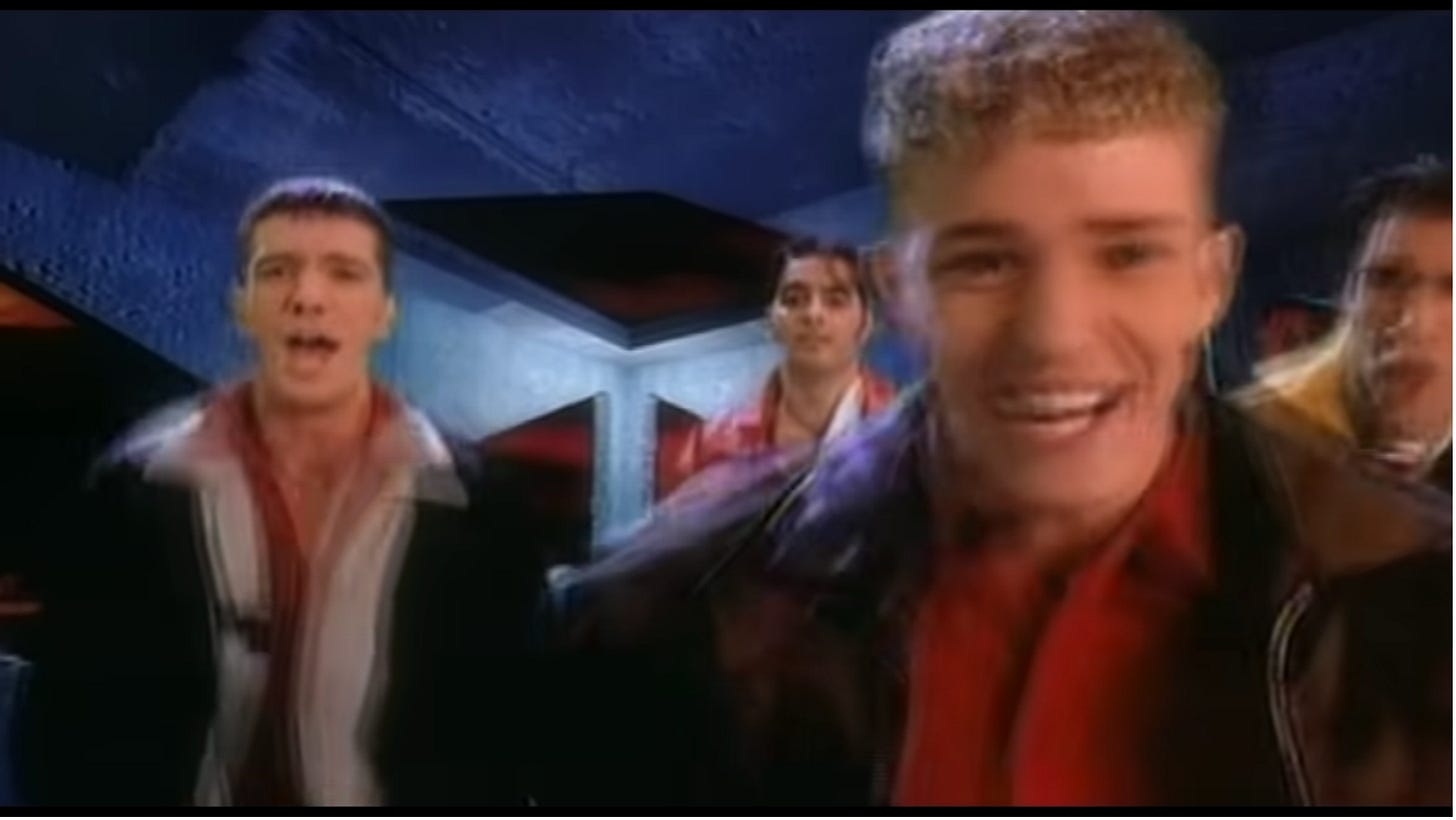 The guys are in their jackets dancing, but Lance is nowhere to be found.