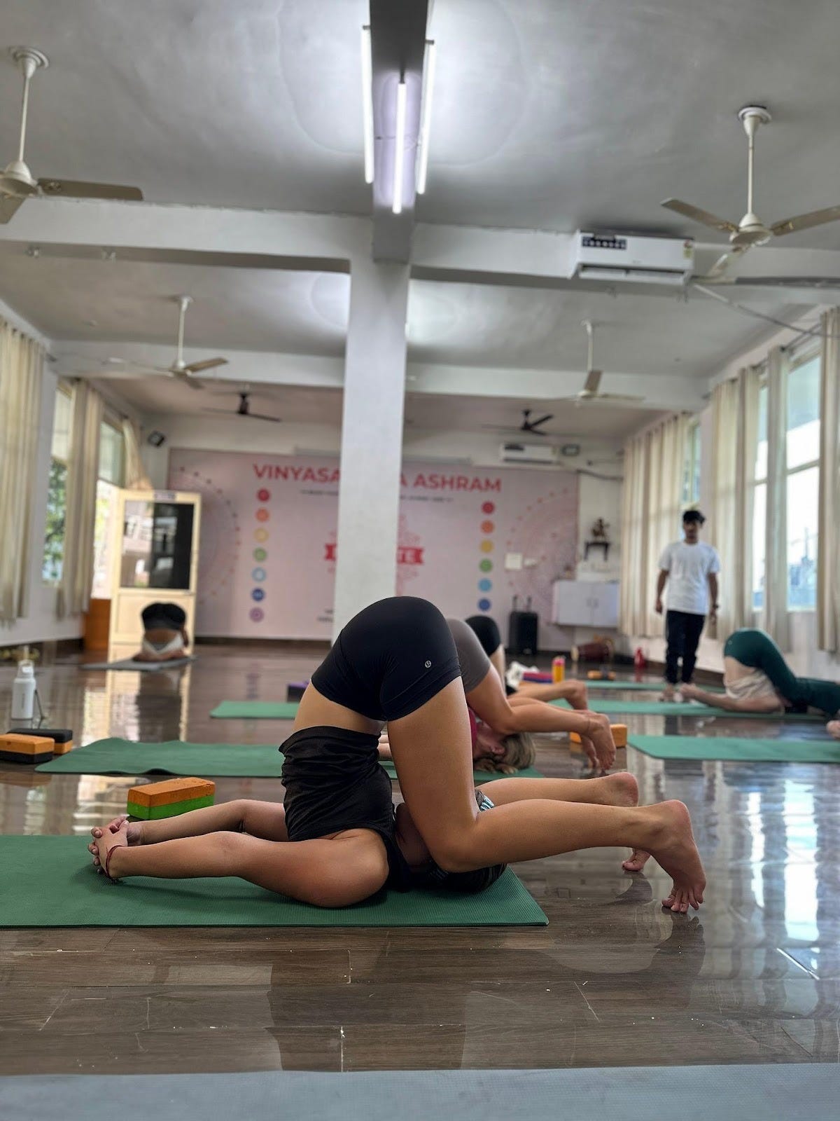 A group of people doing yoga
Description automatically generated A group of people doing yoga
Description automatically generated