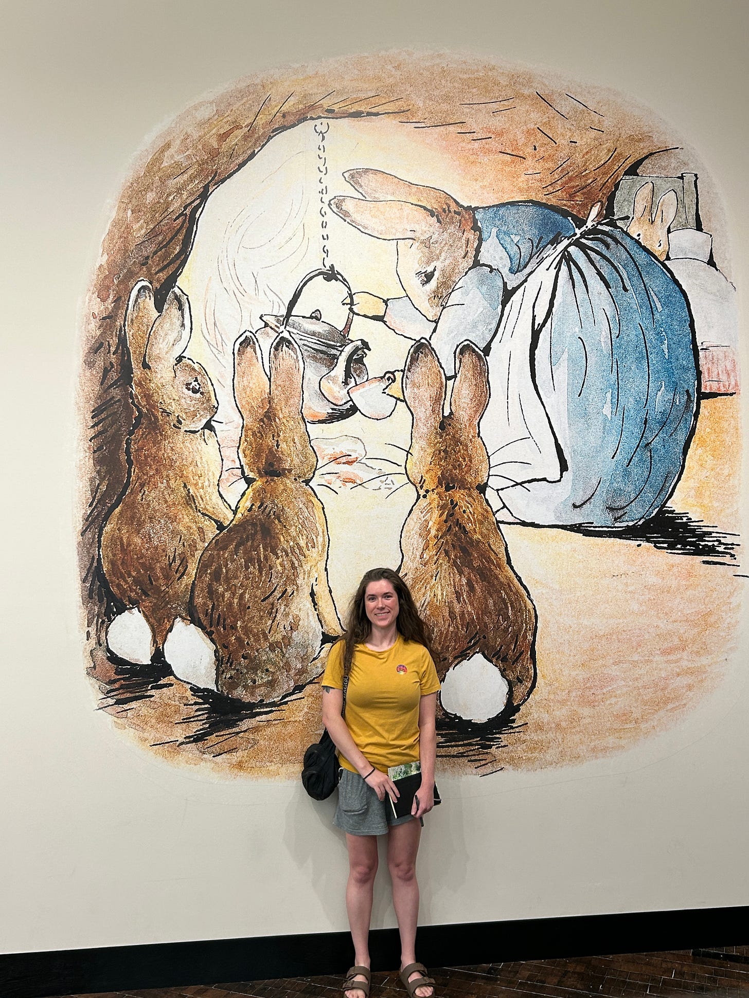 Kayla Stark standing near the entrance to the Beatrix Potter exhibition at the Frist