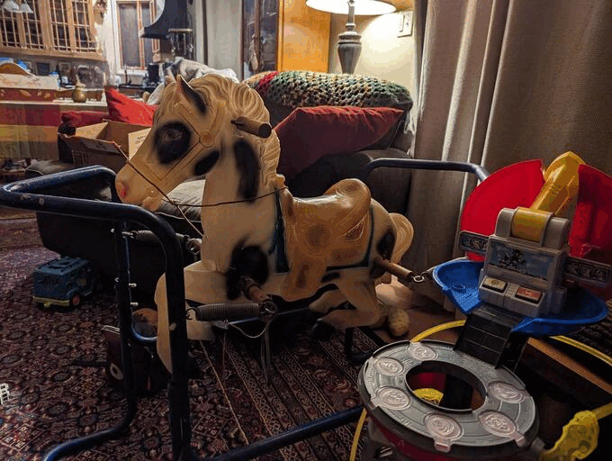 Alternating pictures of a toy horse and an AI generated black spotted horse with the same pose