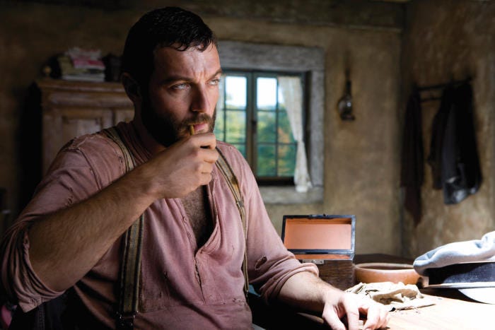 Denis Menochet smokes a pipe in Inglourious Basterds.