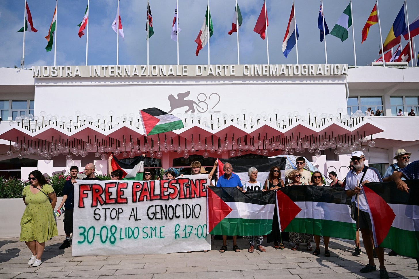 Protesters unfurl 'Stop Genocide' banner at start of Venice Film Festival |  The Times of Israel