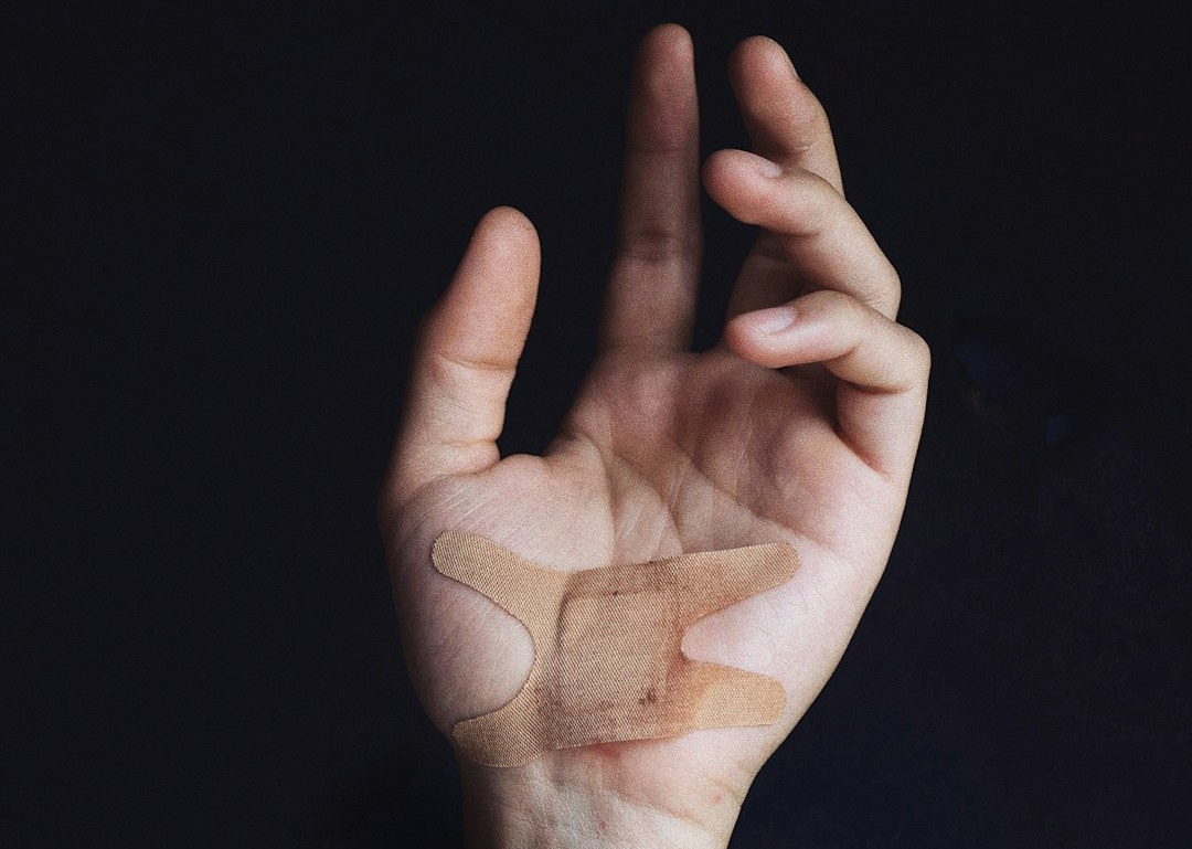 person's left palm with bandage