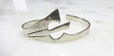 https://www.rubylane.com/item/2013583-ABG192/Taxco-Sterling-Floral-Motif-Link-Bracelet