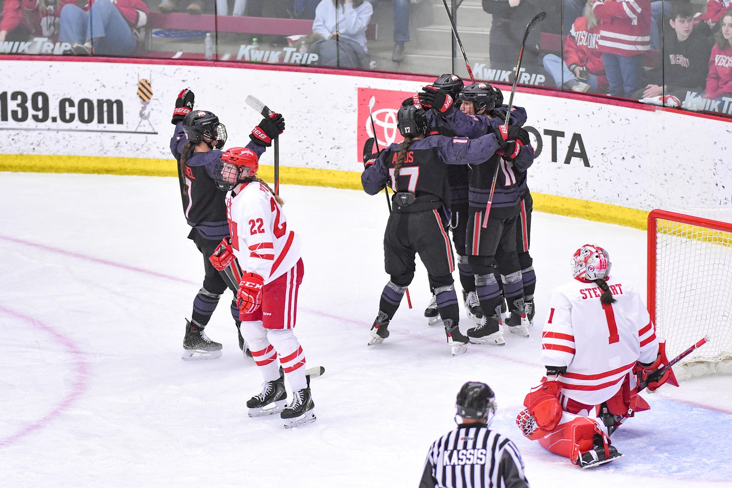A huddle of Ohio State Buckeyes celebrate as Wisconsin women's hockey goaltender Rhyah Stewart and Badgers defender Laney Potter regroup A huddle of Ohio State Buckeyes celebrate as Wisconsin women's hockey goaltender Rhyah Stewart and Badgers defender Laney Potter regroup