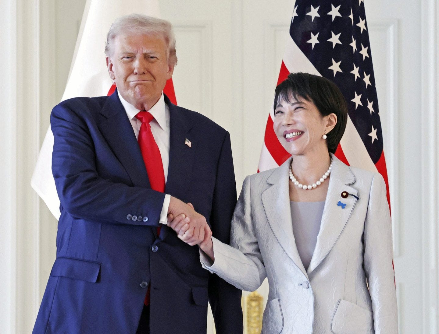 Trump tells Japan's first woman Prime Minister she has a 'very strong  handshake' in Tokyo meeting | Fortune