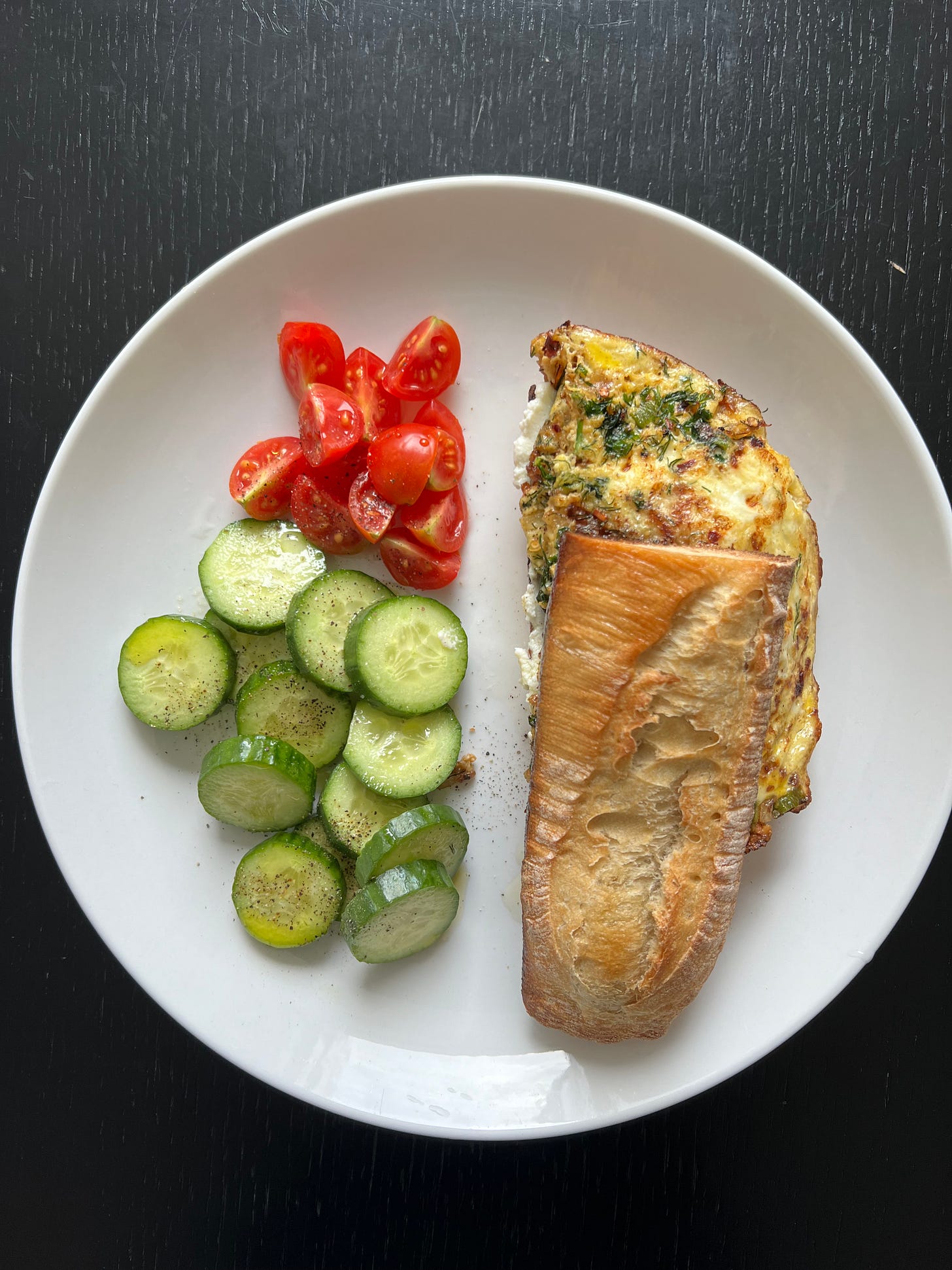 A golden-brown baguette filled with a fluffy omelet, paired with cucumber slices and cherry tomato halves on the side. The freshness and balance of this dish reflect Liat Portal's passion for wholesome, homemade meals, celebrated in Foodie Disorder and featured on The Liat Show. A golden-brown baguette filled with a fluffy omelet, paired with cucumber slices and cherry tomato halves on the side. The freshness and balance of this dish reflect Liat Portal's passion for wholesome, homemade meals, celebrated in Foodie Disorder and featured on The Liat Show.