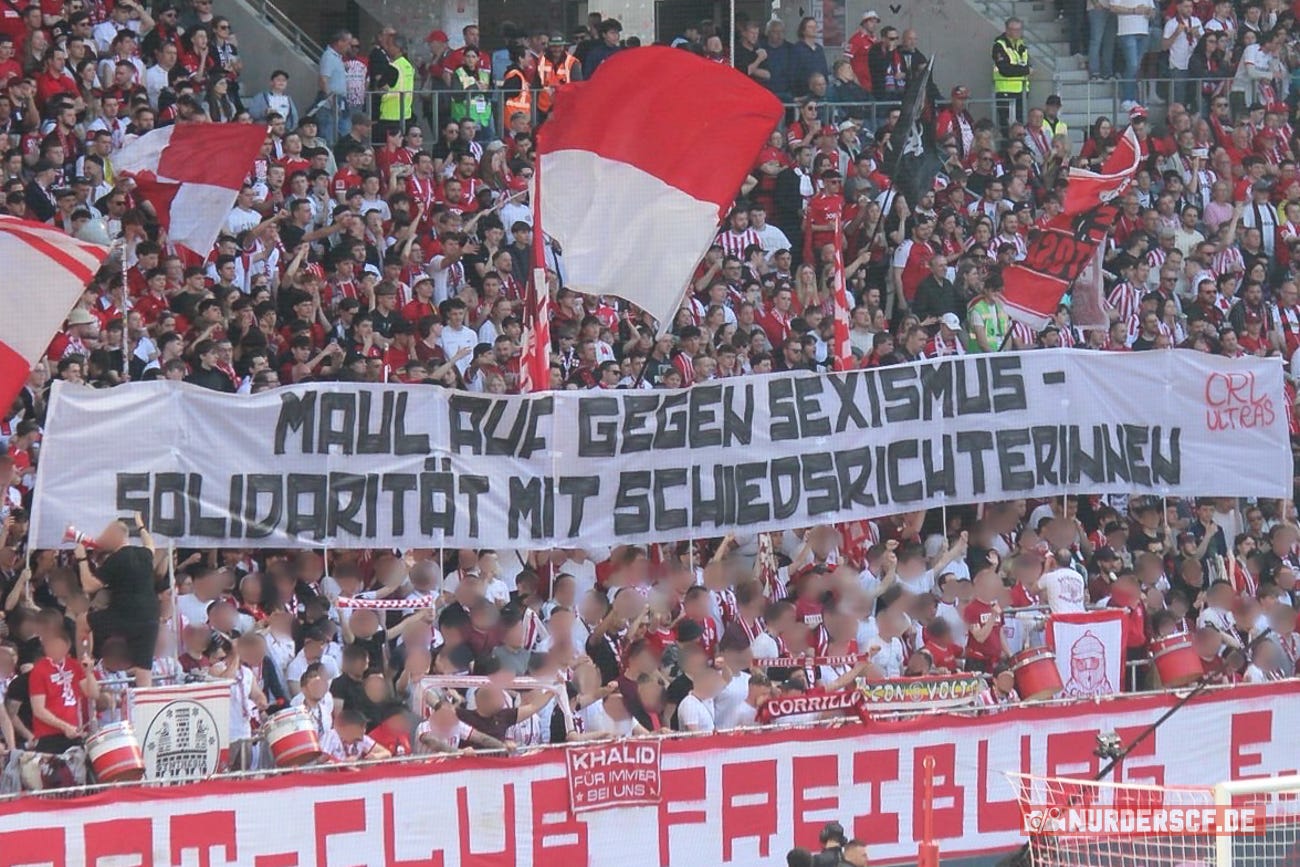 SC Freiburg fans holding banner displaying solidarity with Referee Fabienne Michel SC Freiburg fans holding banner displaying solidarity with Referee Fabienne Michel