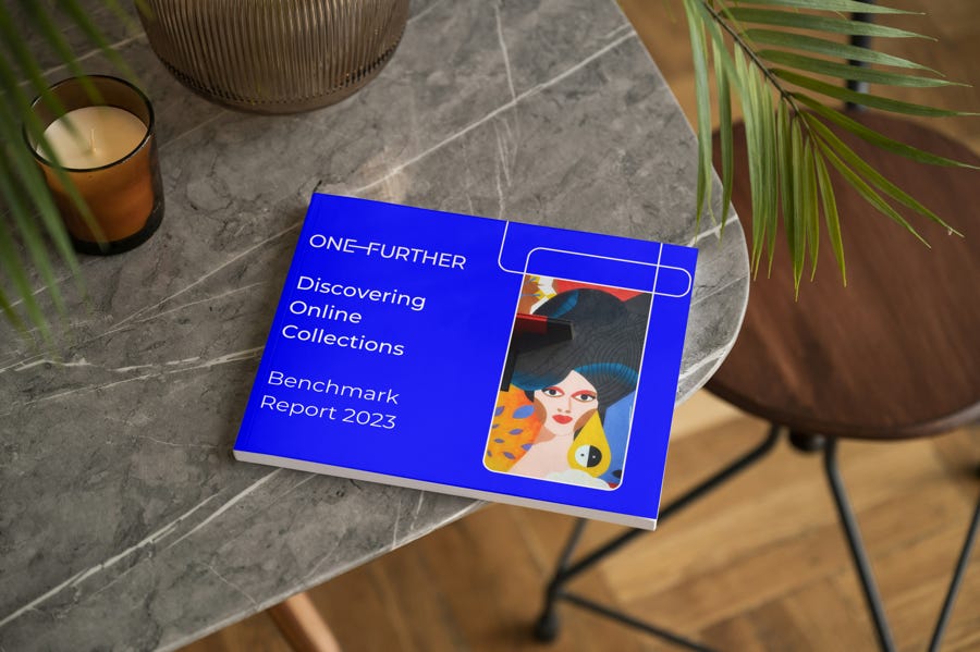 A mockup of the Discovering Online Collections Benchmark Report sat on the edge of a table