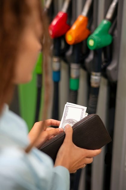 Side view woman at gas station