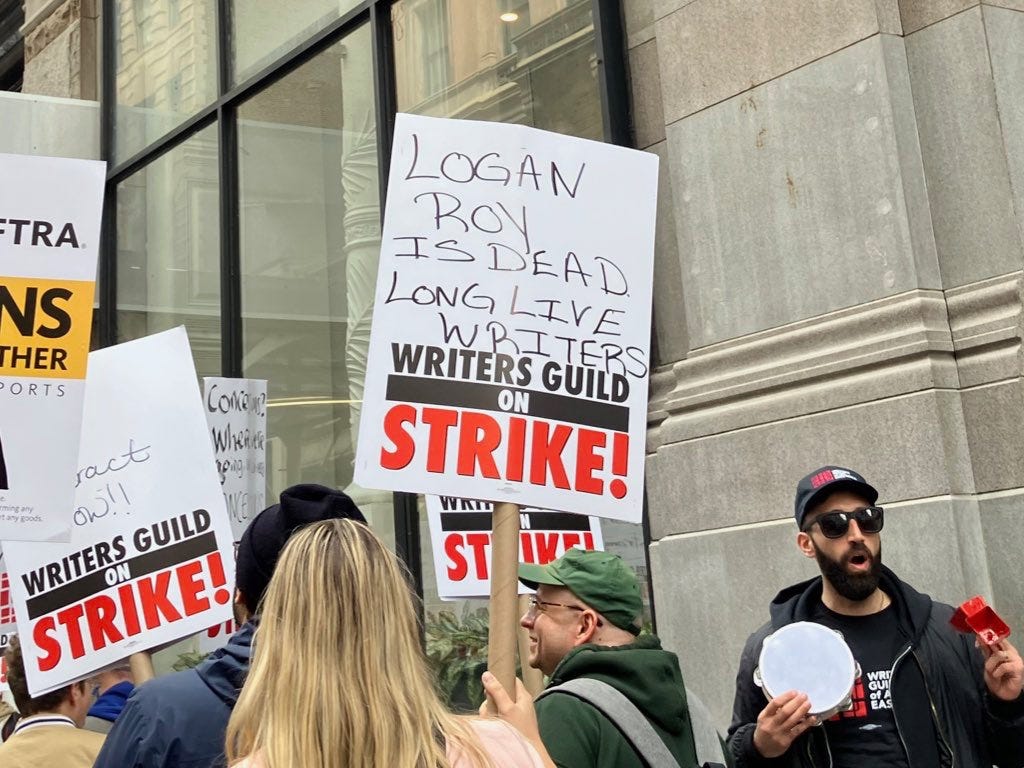 A sign from the 2023 WGA strike that reads: "Logan Roy is dead! Long live writers!"