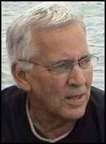 A person with glasses and a black shirt

Description automatically generated