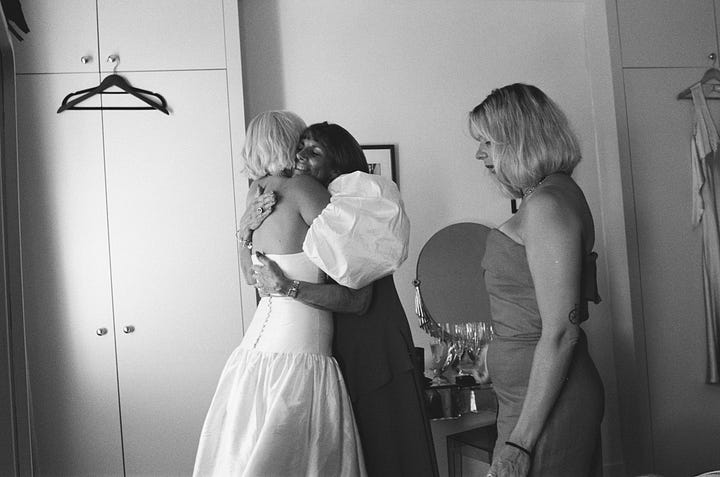 A bride getting dressed before her wedding