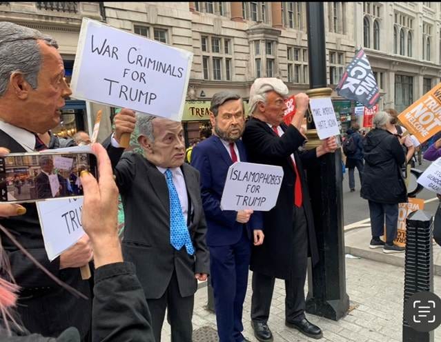 A group of people holding signs