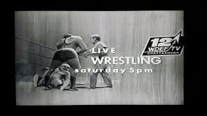 May be an image of television and text that says '120 LIVE WOEFTV LCATIANGOO WRESTLING saturday day 5p 5pm' May be an image of television and text that says '120 LIVE WOEFTV LCATIANGOO WRESTLING saturday day 5p 5pm'