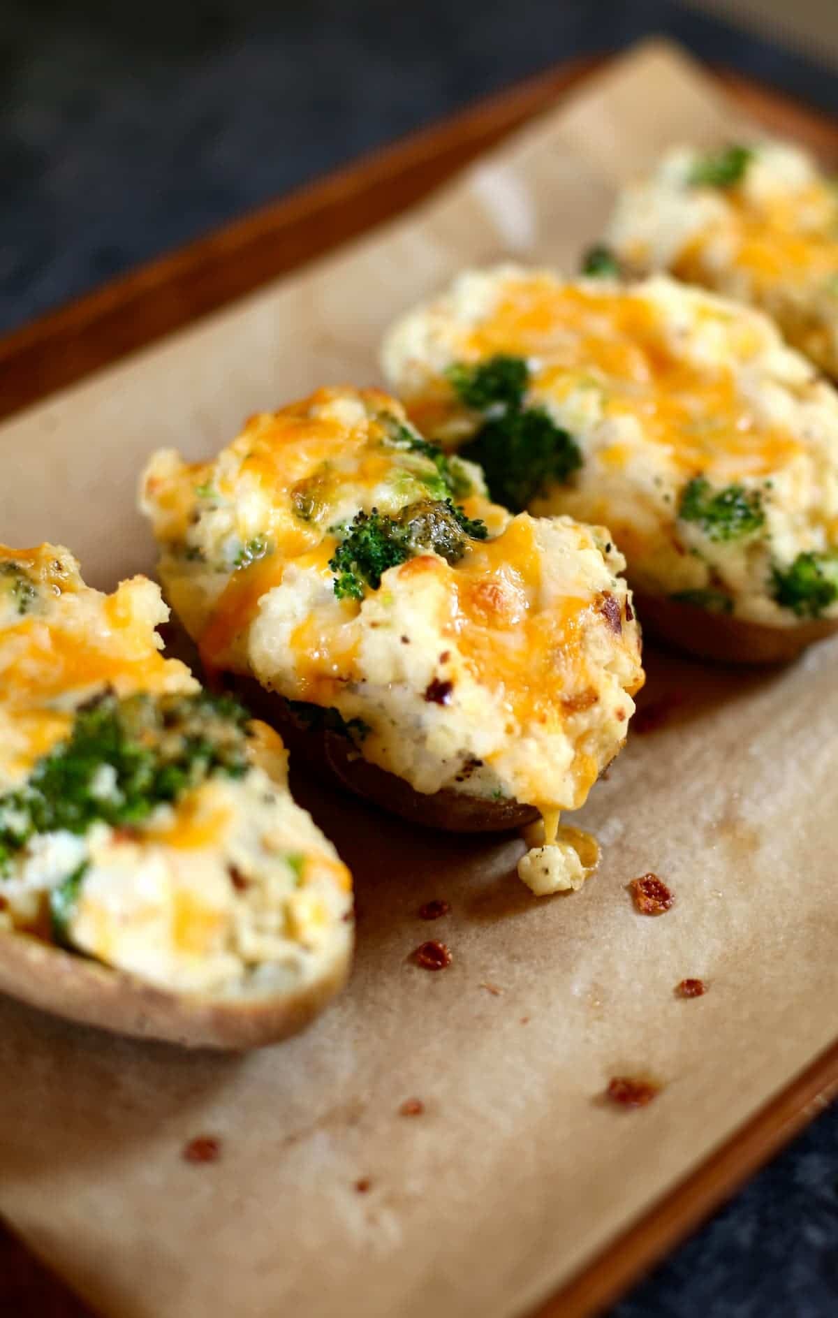 a close up photo of broccoli twice stuffed potatoes.