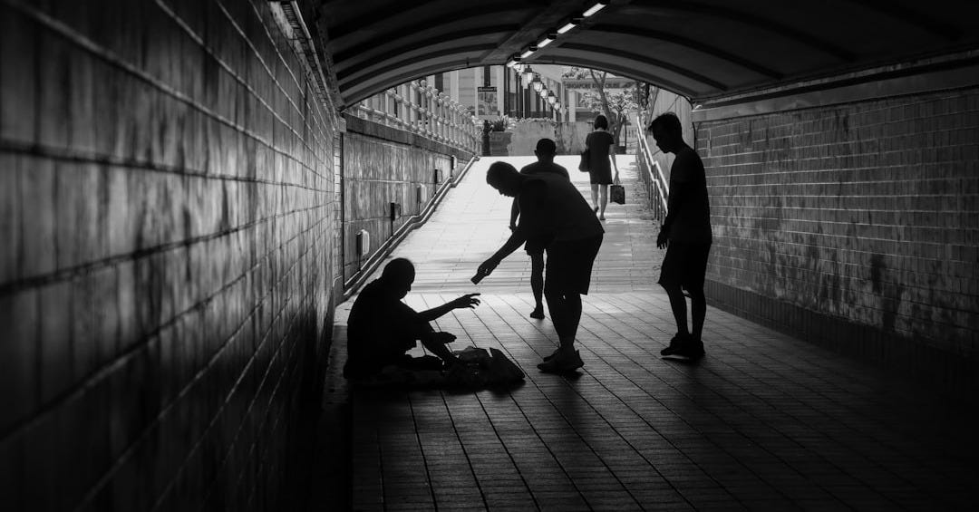 a group of people standing in a tunnel