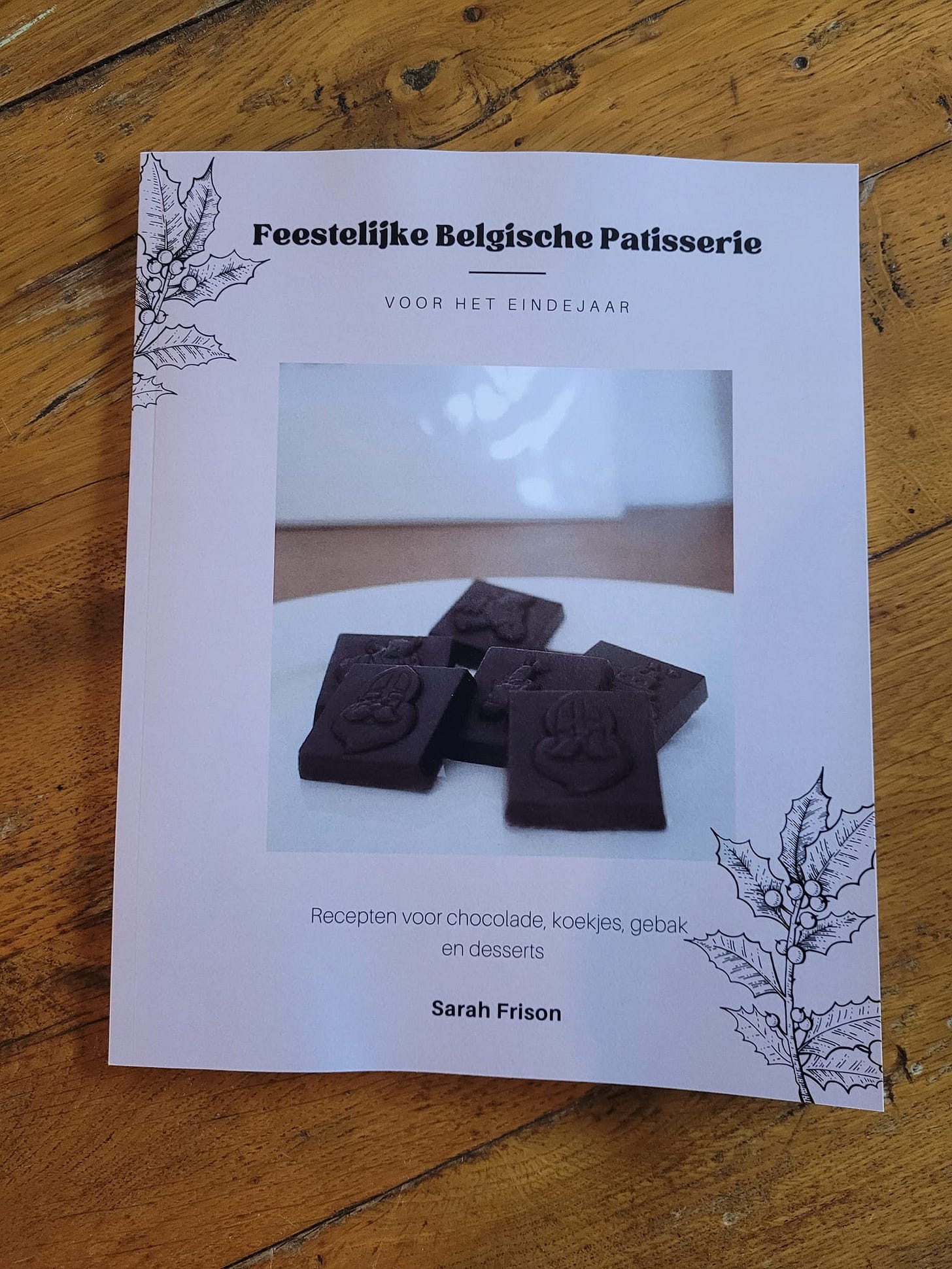 photo of Sarah's book on wooden floorboards