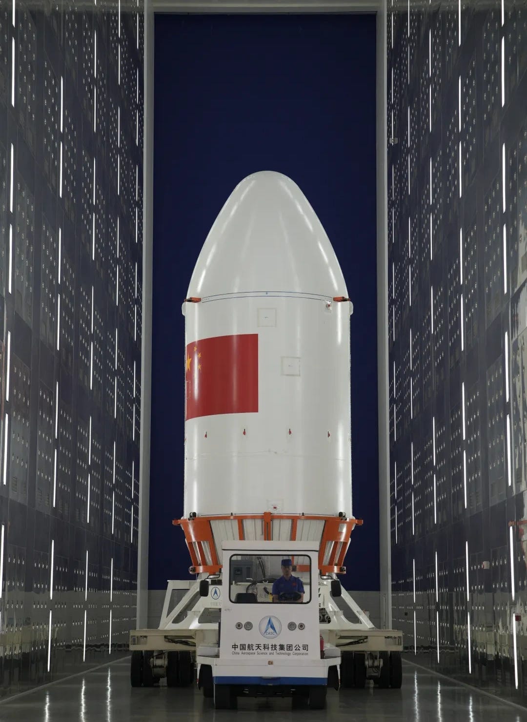 The Long March 7A’s fairing heading from its cleanroom towards a vehicle assembly bay for stacking with the rest of the launch vehicle.