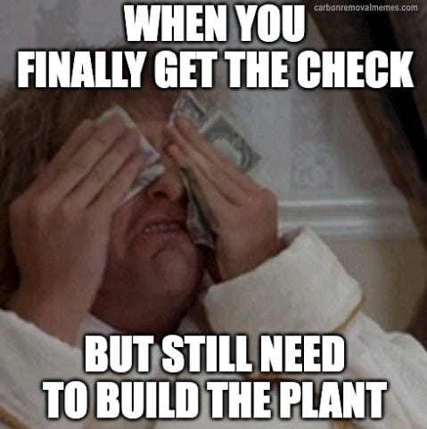 A man in a period costume weeps with relief, wiping his eyes with banknotes, under the text "WHEN YOU FINALLY GET THE CHECK" and above "BUT STILL NEED TO BUILD THE PLANT".