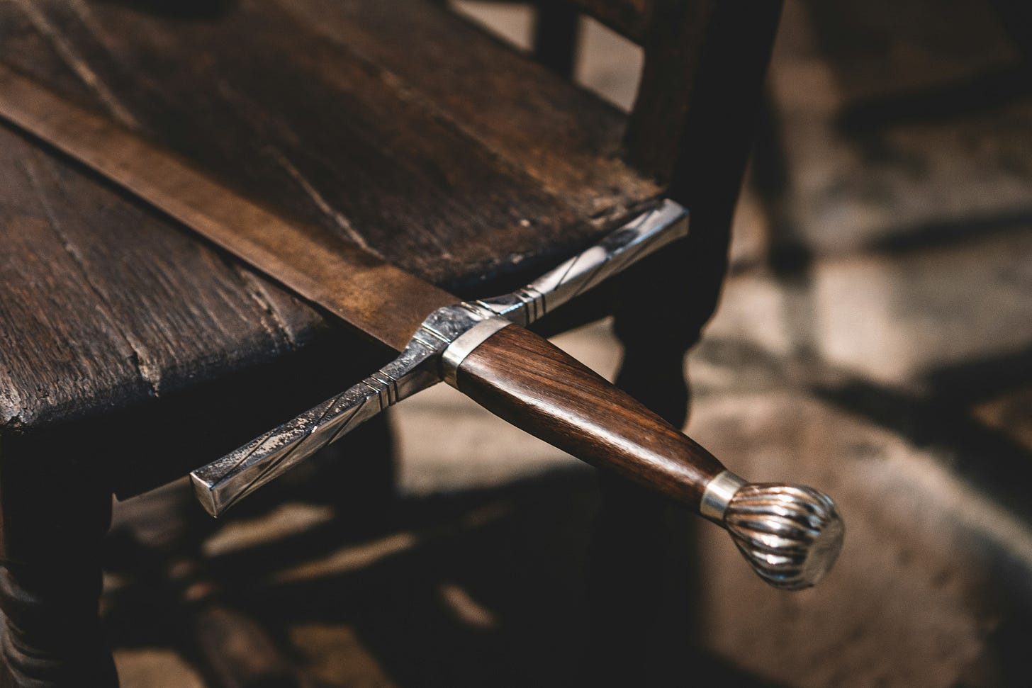 A sword balanced on a table. 