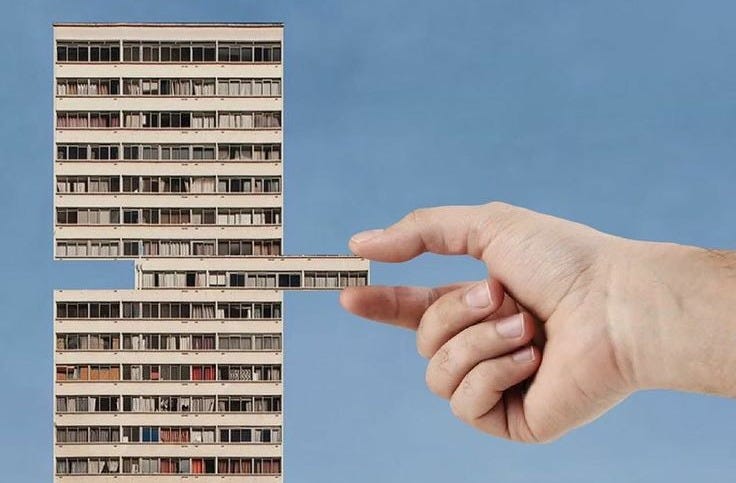 This may contain: a hand holding a pencil in front of a tall building that has multiple balconies on it This may contain: a hand holding a pencil in front of a tall building that has multiple balconies on it
