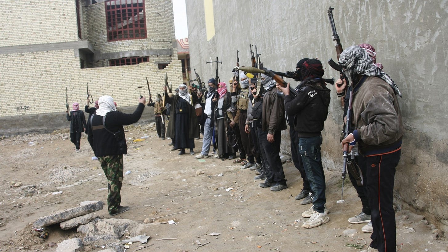 A group of people in riot gear

Description automatically generated with low confidence