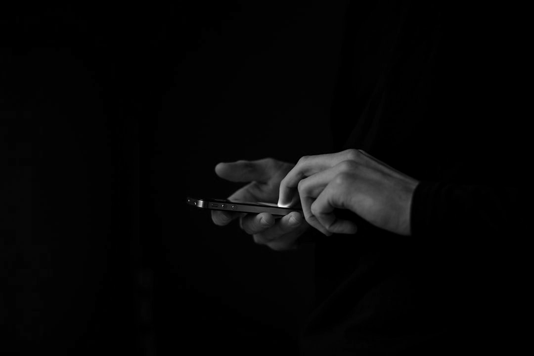 silhouette photo of person holding smartphone silhouette photo of person holding smartphone