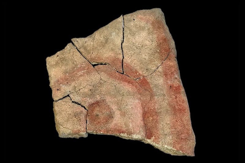 The painted slab from Wetar Island as it appears without enhancement, carrying a motif widely painted on rock surfaces across the region.
